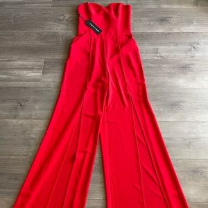 BEBE strapless jumpsuit wide leg size 4 in red